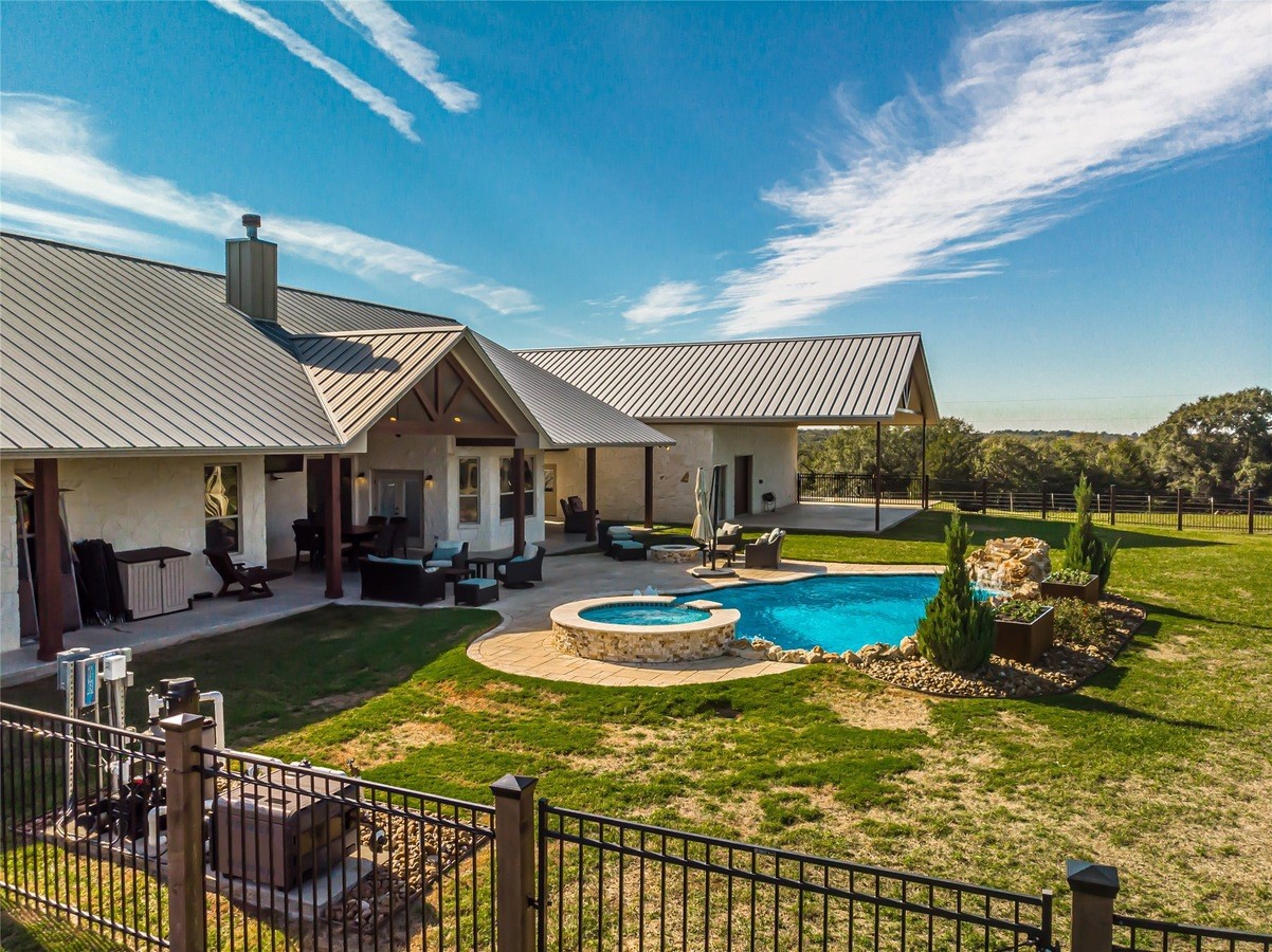 4999 Pin Oak Road Franklin, TX 77856 - Photo 35 of 47 a view of a house with swimming pool and sitting area