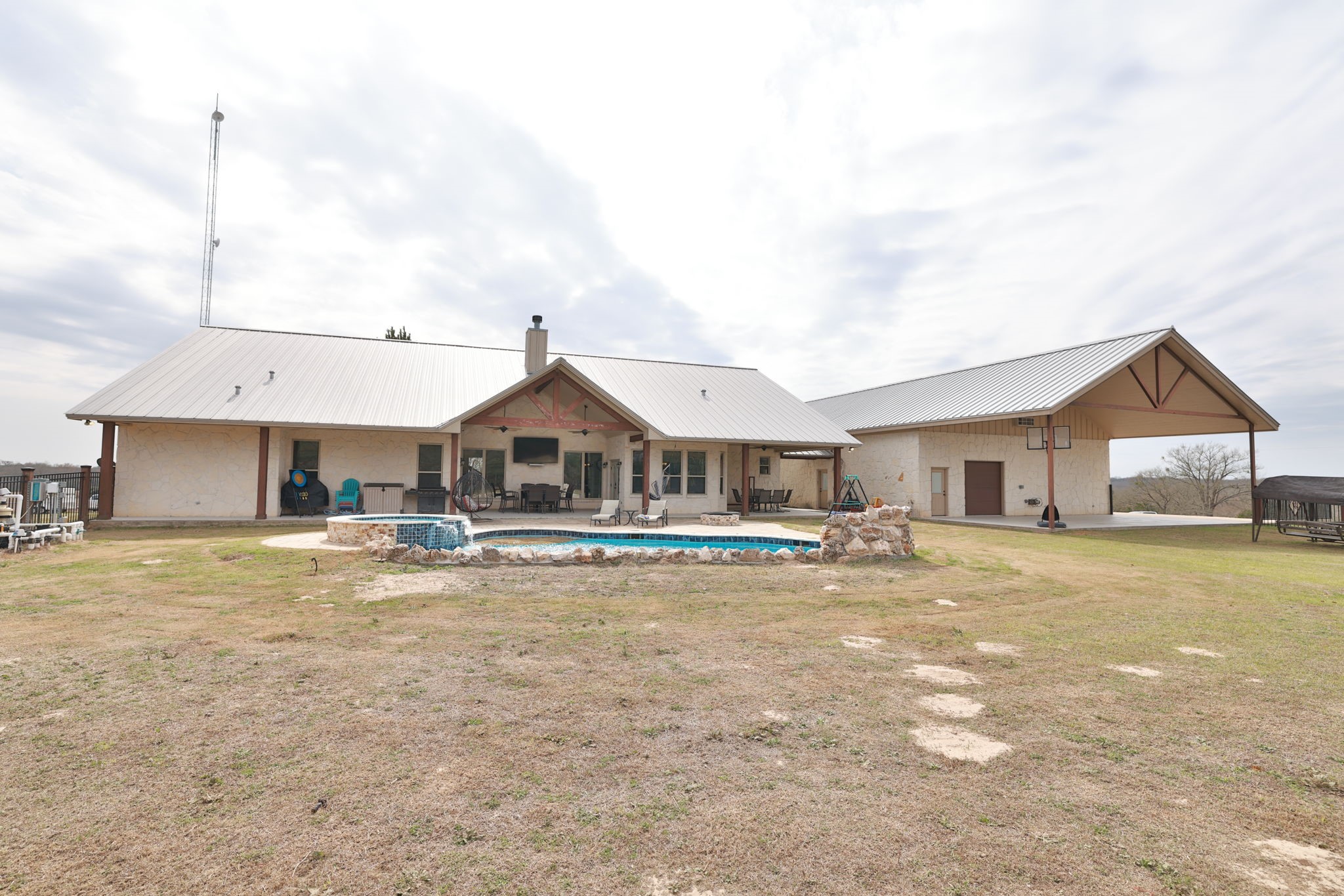 4999 Pin Oak Road Franklin, TX 77856 - Photo 40 of 47 a house view with a sitting space and garden space