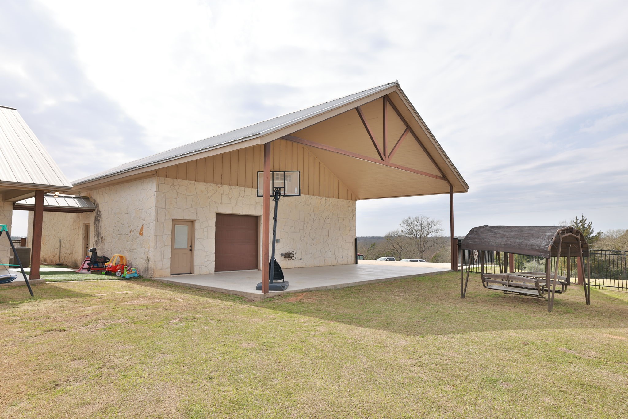4999 Pin Oak Road Franklin, TX 77856 - Photo 43 of 47 a view of a house with backyard and sitting area
