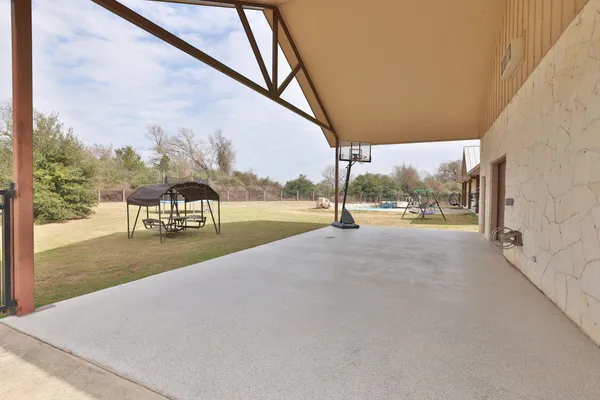 a view of empty room with garage and yard