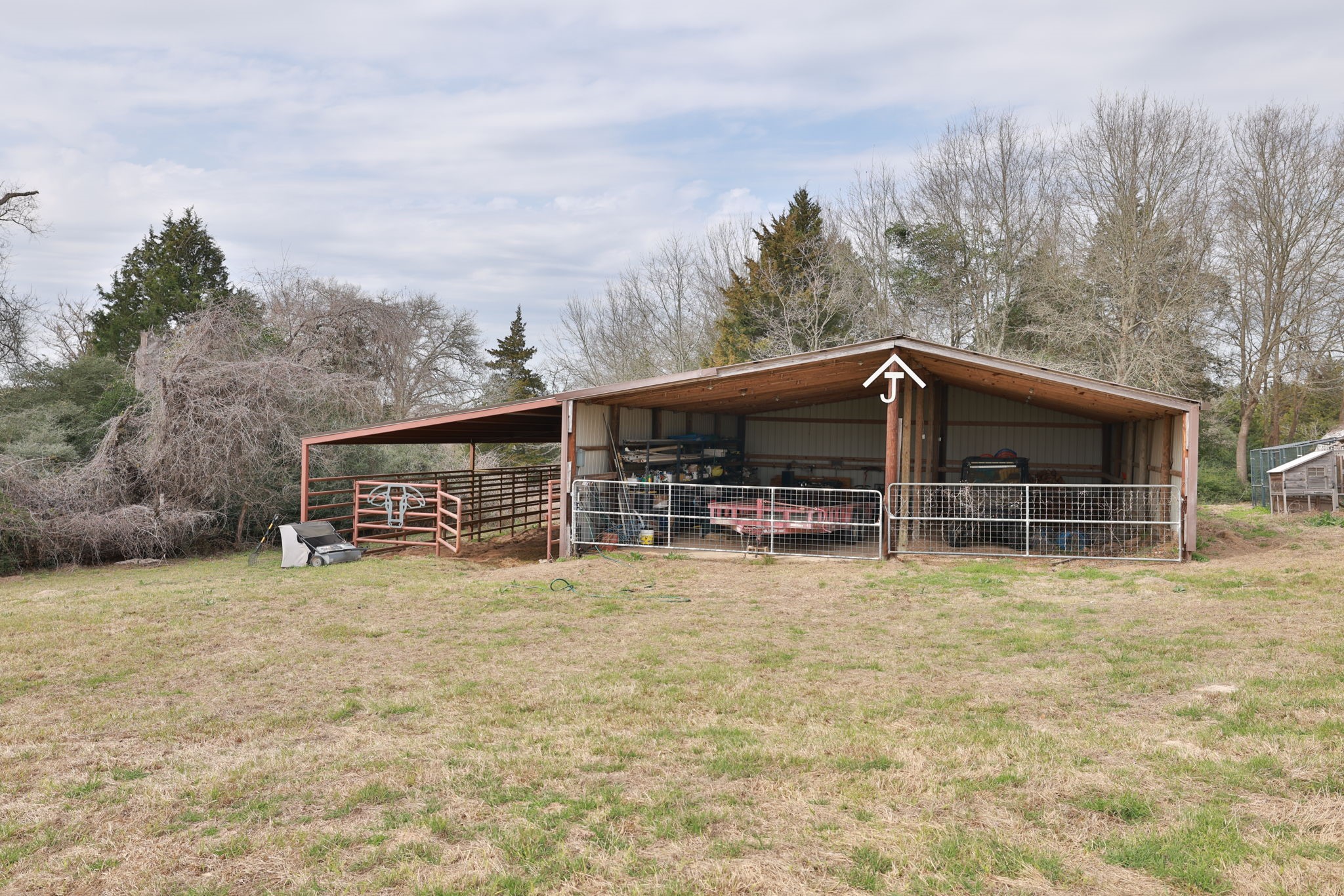 4999 Pin Oak Road Franklin, TX 77856 - Photo 47 of 47 a house with trees in the background