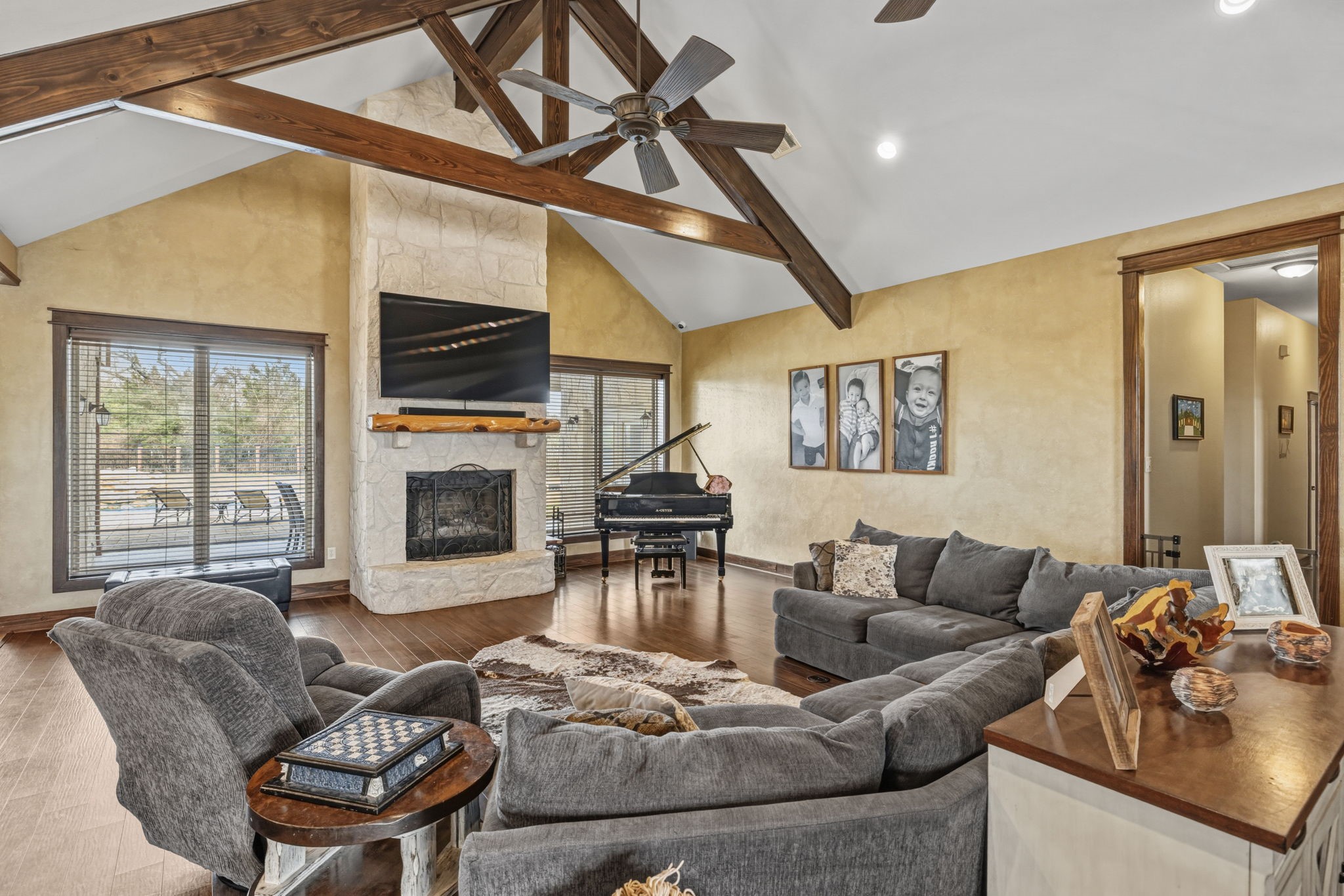 4999 Pin Oak Road Franklin, TX 77856 - Photo 8 of 47 a living room with furniture a fireplace and a flat screen tv