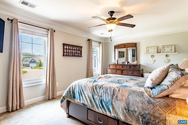 a spacious bathroom with a double vanity sink and a mirror