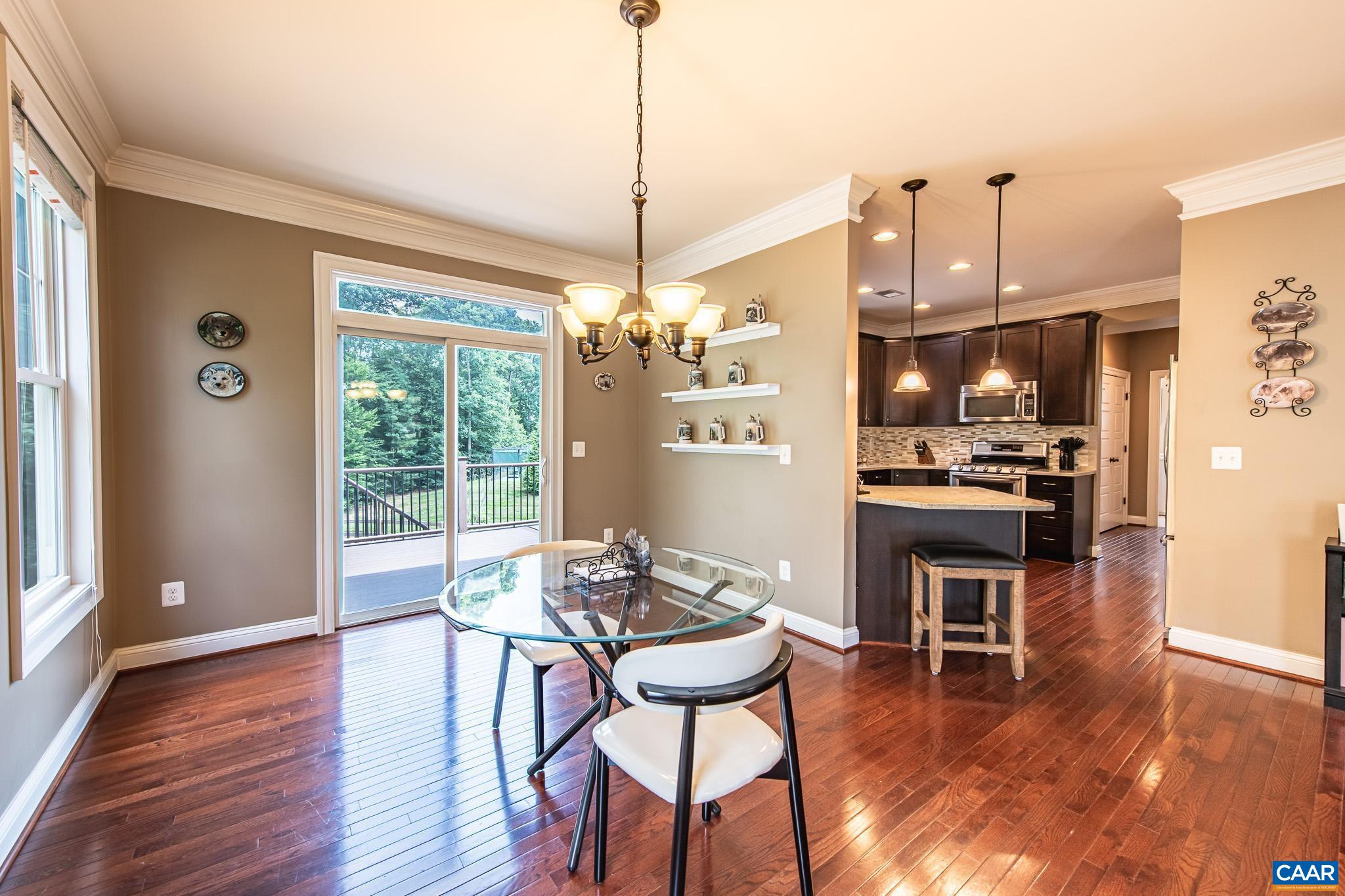 38 Timber Ridge Court Zion Crossroads, VA 22942 - Photo 25 of 72 a view of a dining room with furniture window and wooden floor