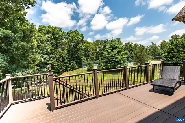 an aerial view of a house with a swimming pool