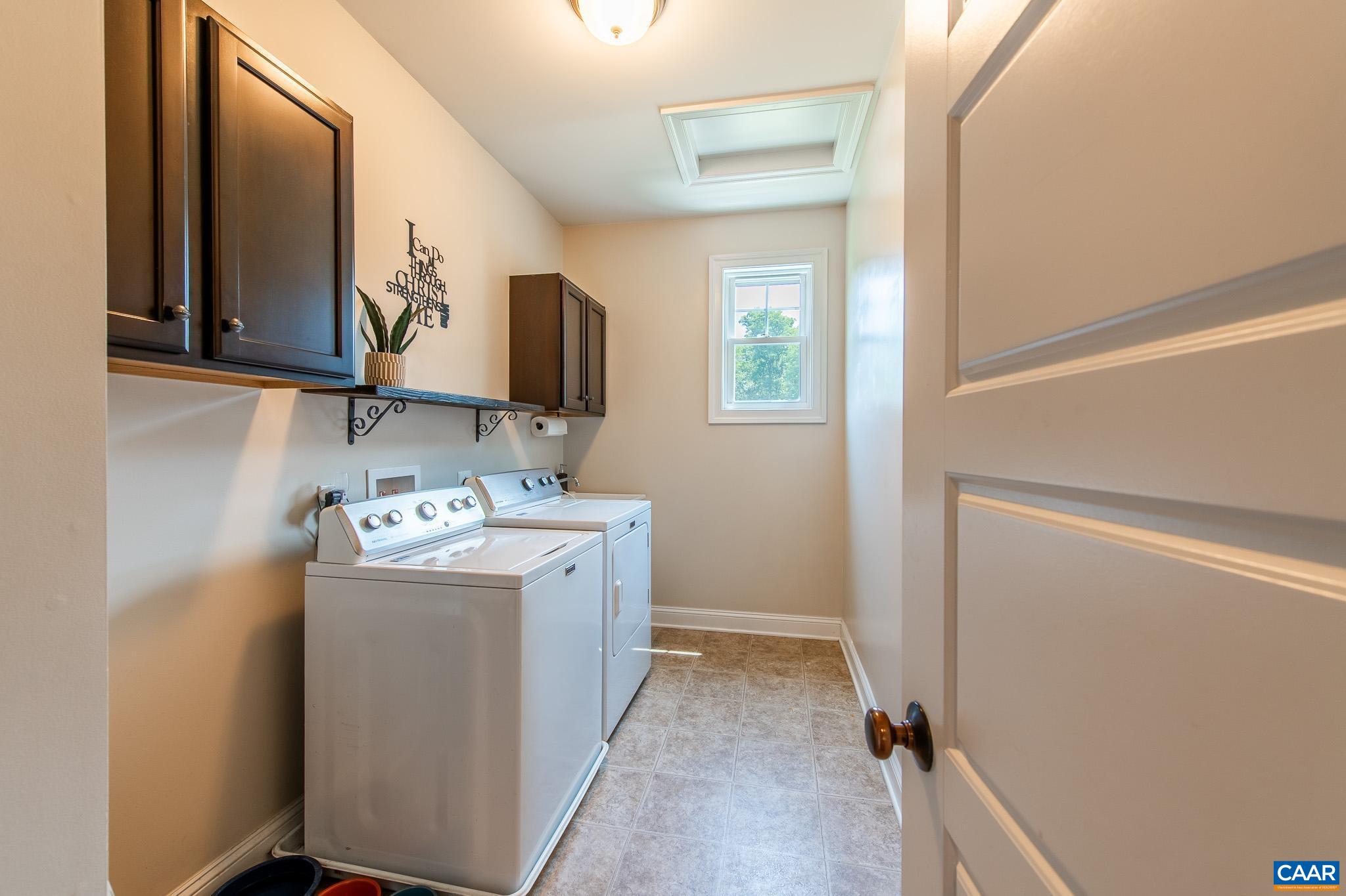 38 Timber Ridge Court Zion Crossroads, VA 22942 - Photo 31 of 72 a utility room with cabinets washer and dryer