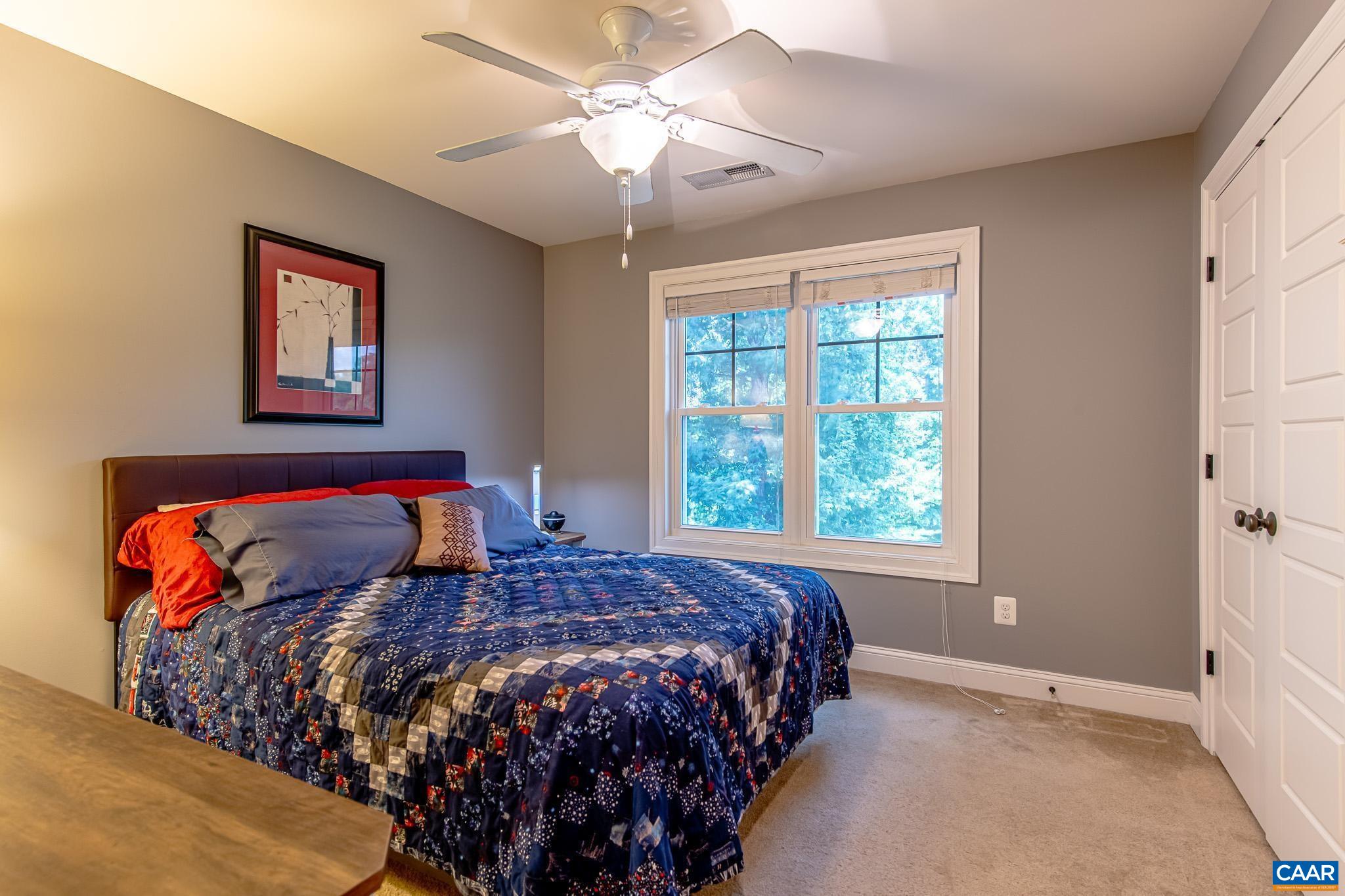 38 Timber Ridge Court Zion Crossroads, VA 22942 - Photo 39 of 72 a bed sitting in a bedroom next to a window
