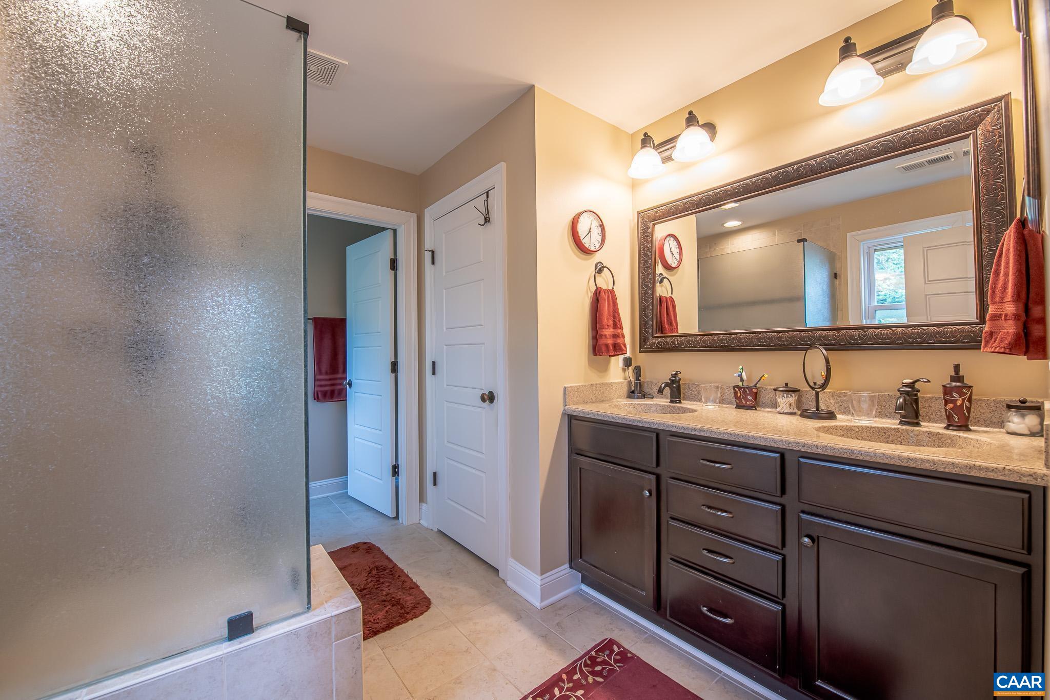 38 Timber Ridge Court Zion Crossroads, VA 22942 - Photo 5 of 72 a spacious bathroom with a double vanity sink and a mirror