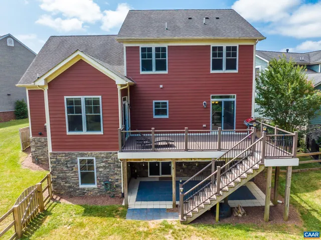 a view of a house with a yard and garage