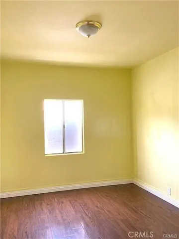 an empty room with a empty space and a window