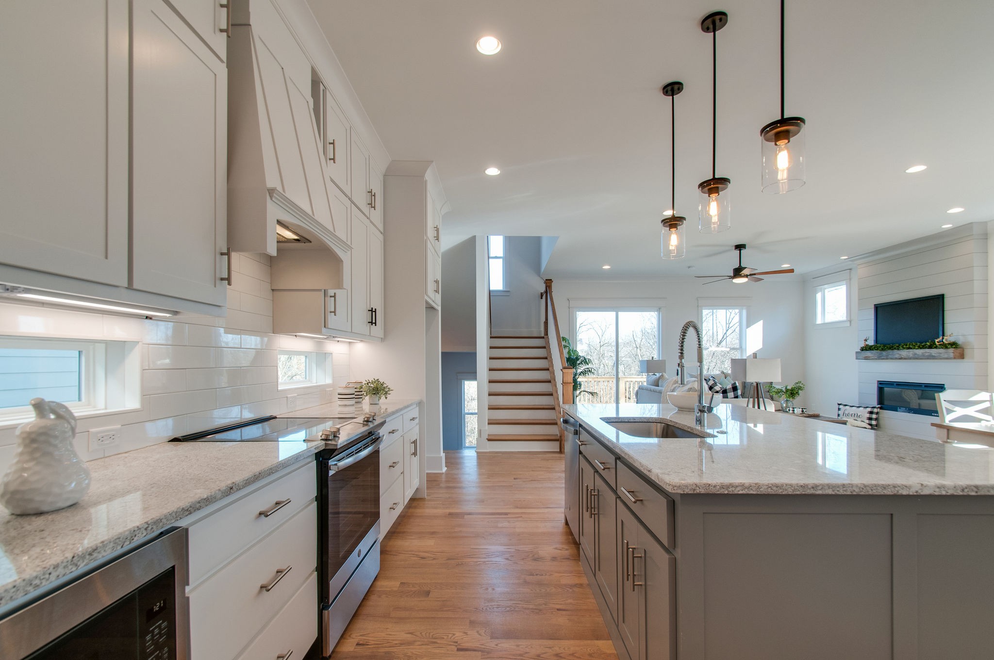 929 Mitchell Road Nashville, TN 37206 - Photo 11 of 48 a large kitchen with a counter space a sink stainless steel appliances and cabinets