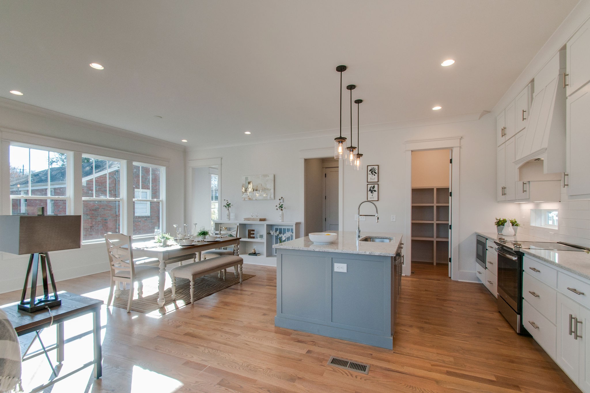 929 Mitchell Road Nashville, TN 37206 - Photo 22 of 48 a large kitchen with stainless steel appliances kitchen island granite countertop a large island in the center