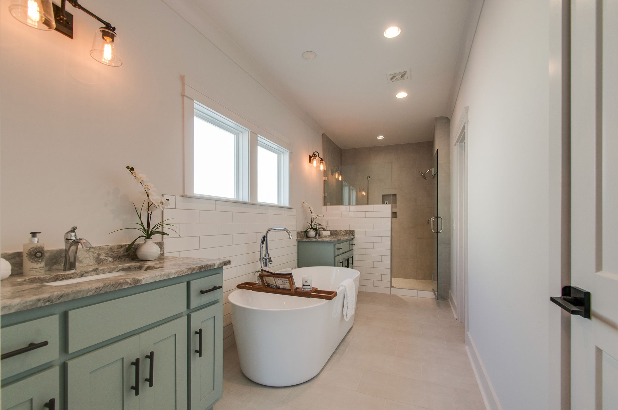 929 Mitchell Road Nashville, TN 37206 - Photo 28 of 48 a bathroom with a double vanity sink and mirror