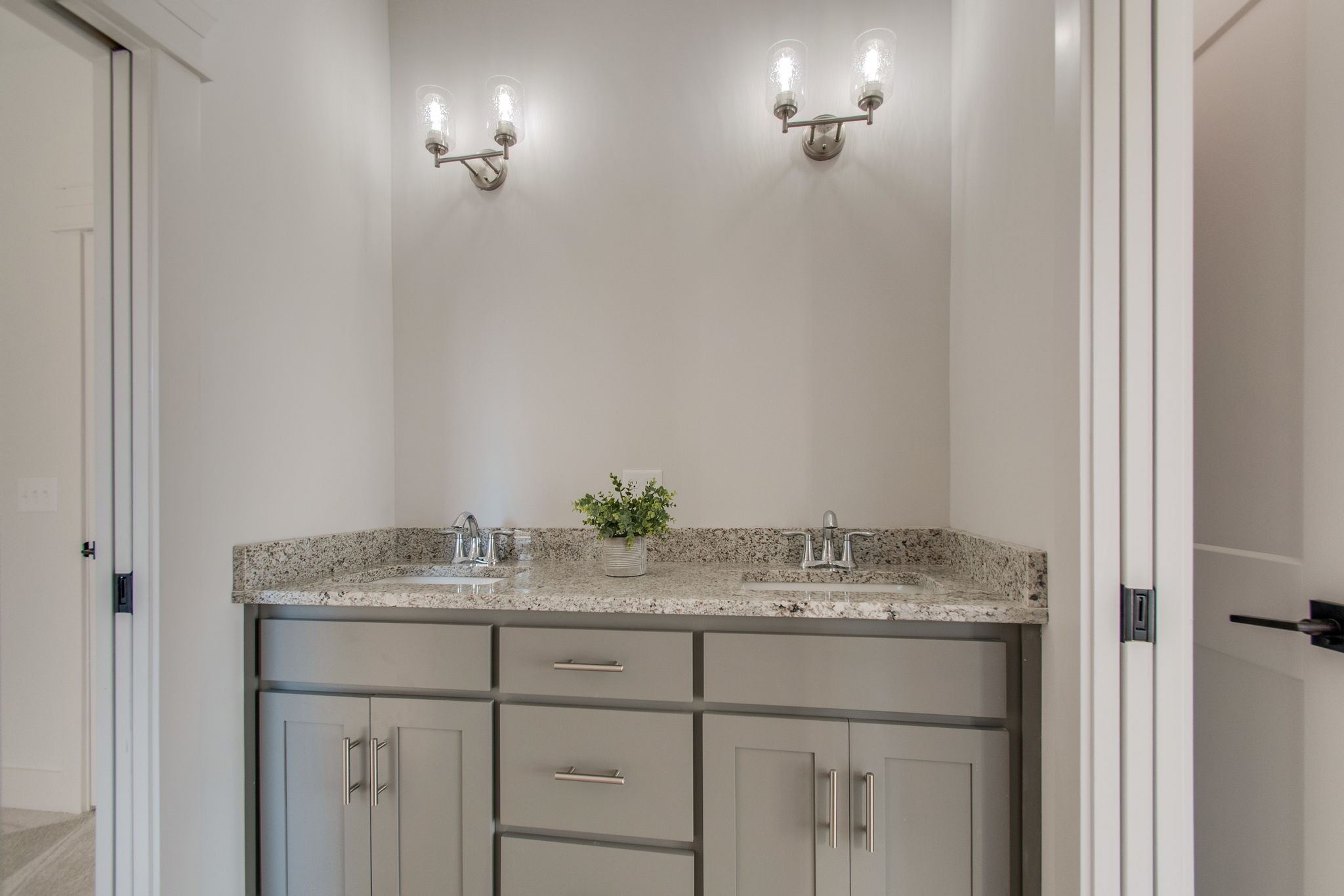 929 Mitchell Road Nashville, TN 37206 - Photo 30 of 48 a bathroom with a granite countertop sink and a mirror