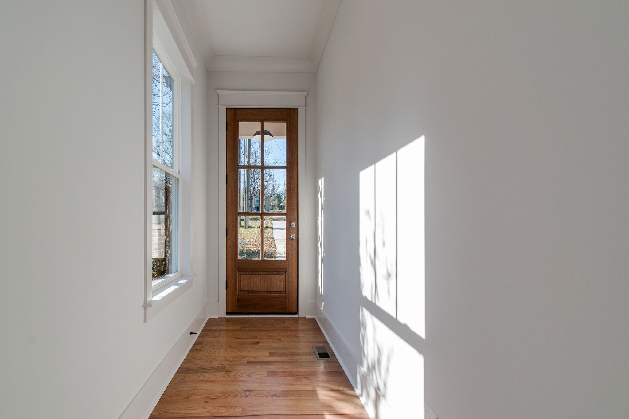 929 Mitchell Road Nashville, TN 37206 - Photo 4 of 48 a view of an entryway with wooden floor and front door