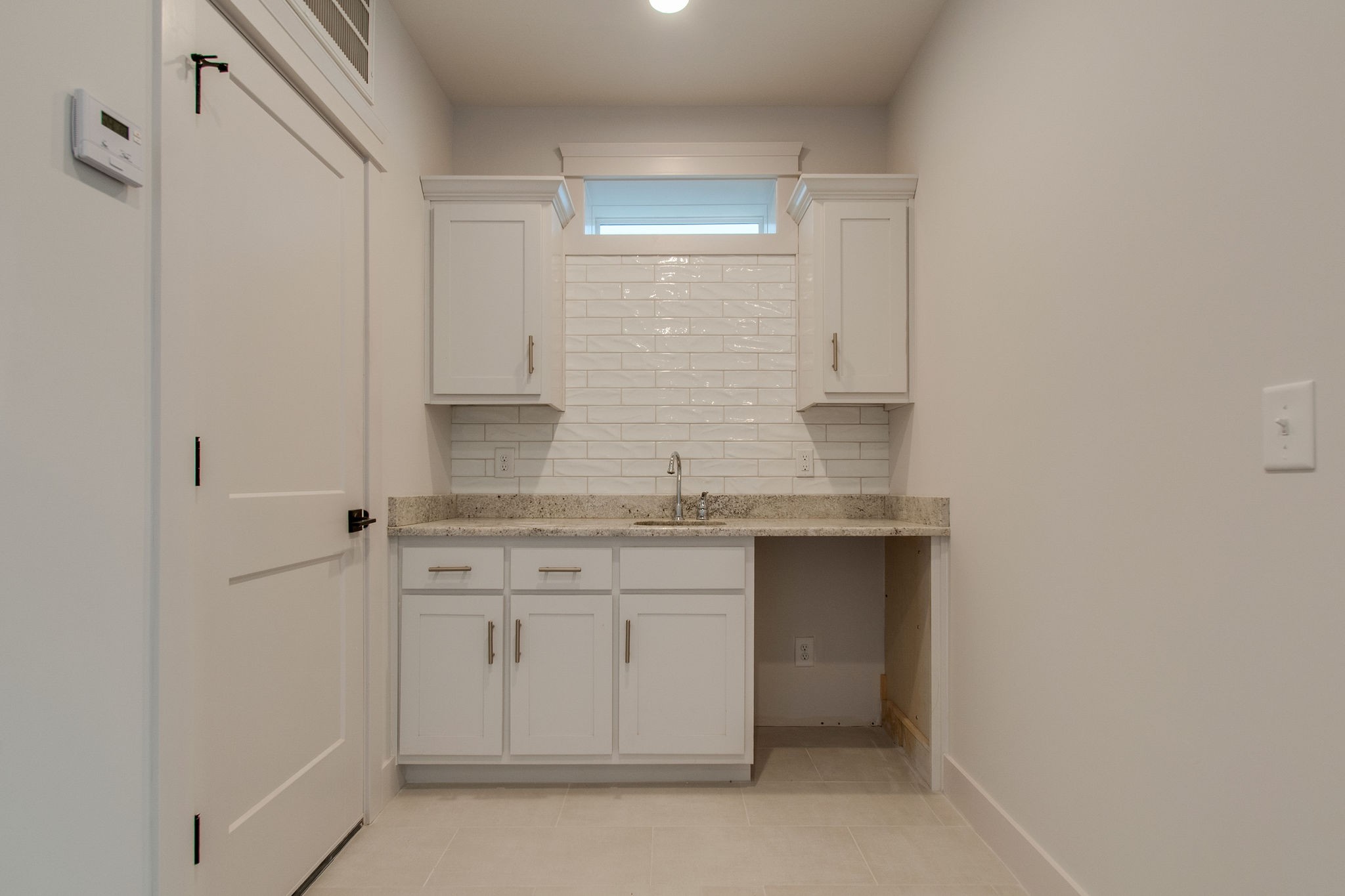 929 Mitchell Road Nashville, TN 37206 - Photo 36 of 48 a bathroom with a granite countertop sink and a mirror