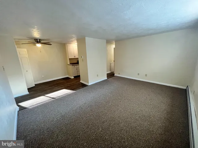 an empty room with a bathroom