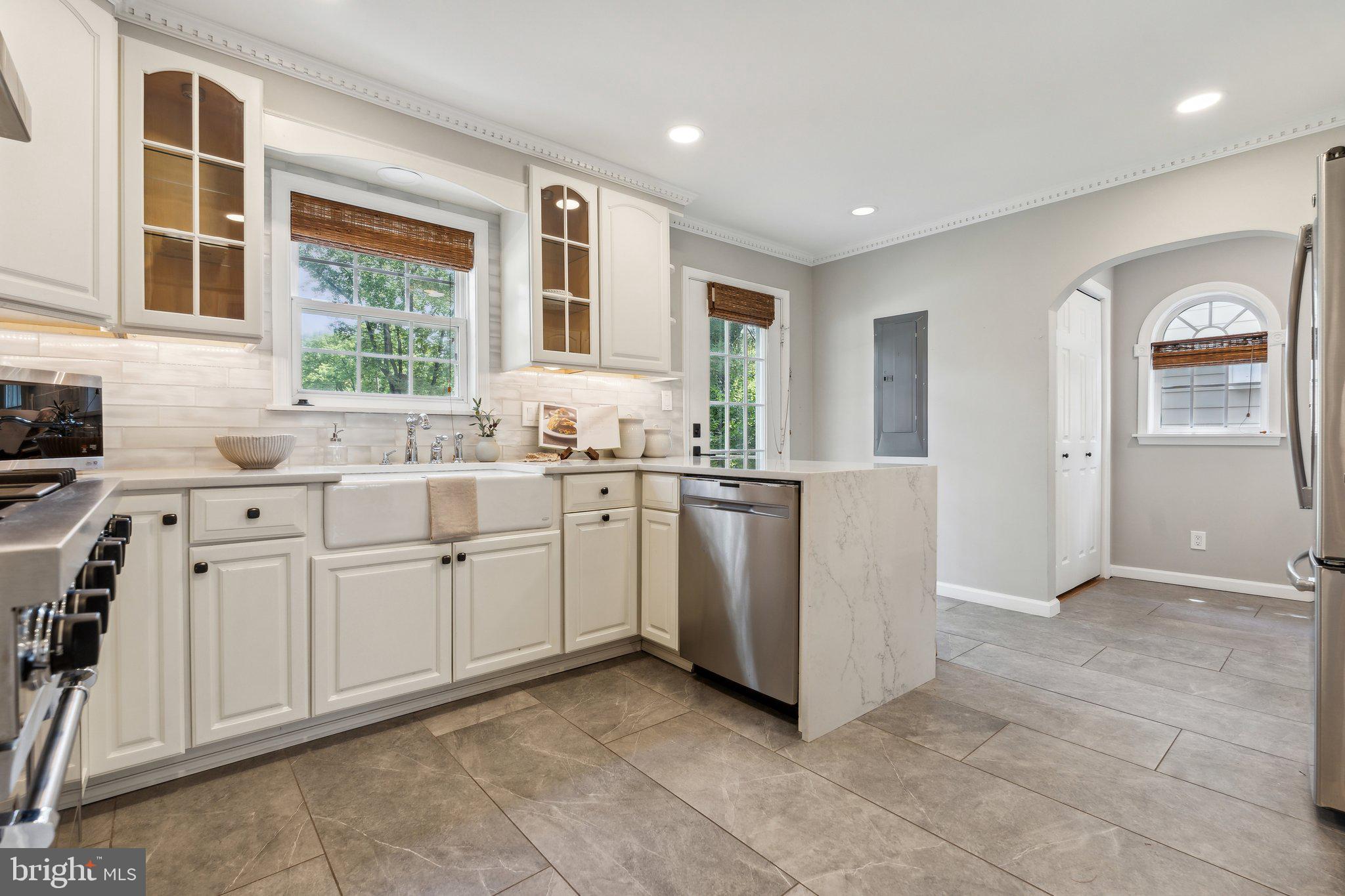 703 Roxboro Road Rockville, MD 20850 - Photo 15 of 55 a room with white cabinets and window
