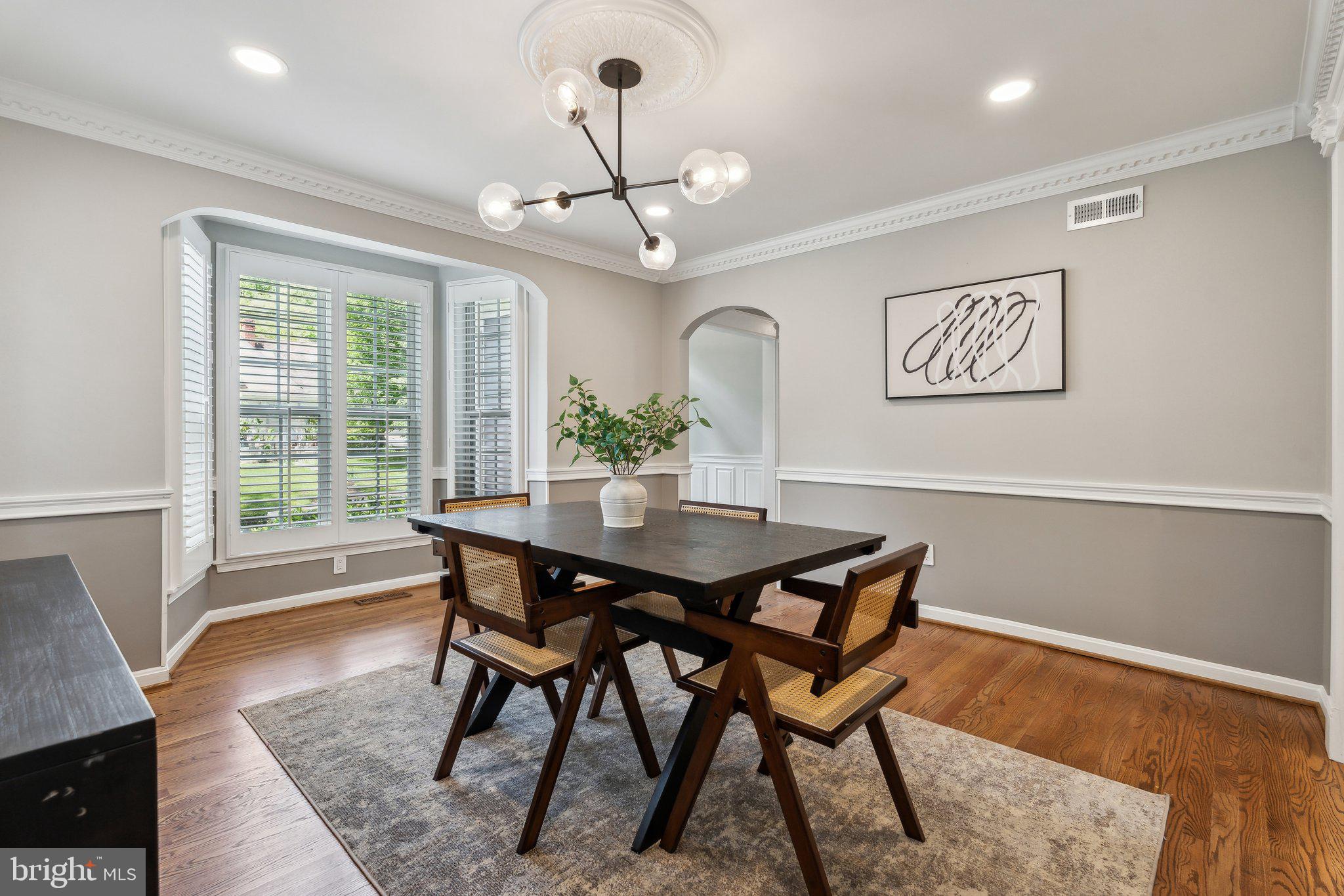 703 Roxboro Road Rockville, MD 20850 - Photo 18 of 55 a view of a dining room with furniture window and wooden floor