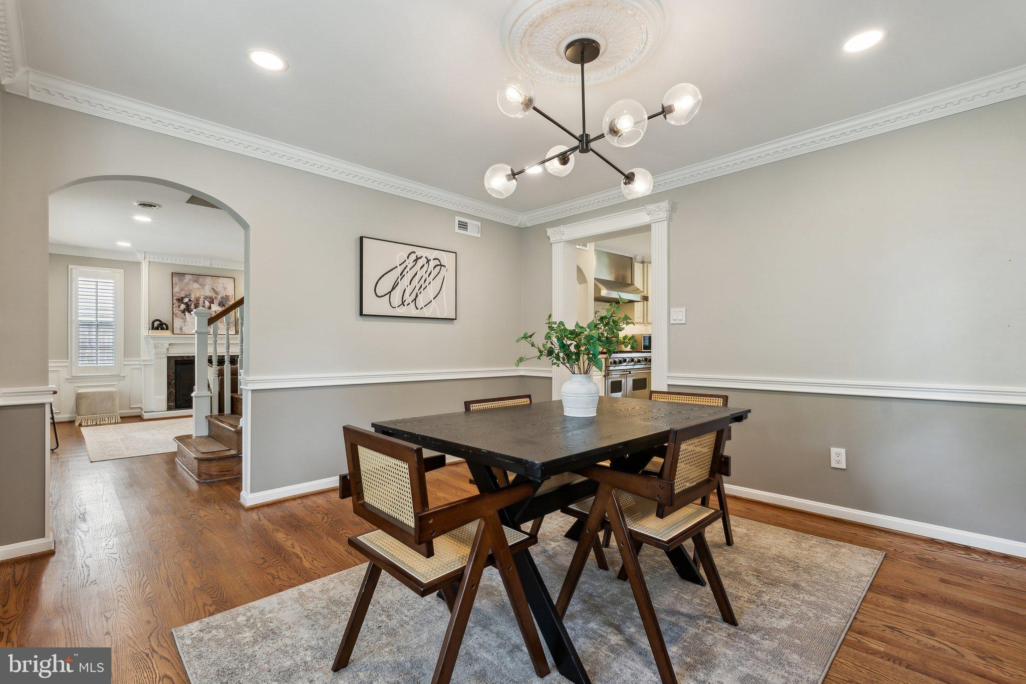 703 Roxboro Road Rockville, MD 20850 - Photo 19 of 55 a view of a dining room with furniture and wooden floor