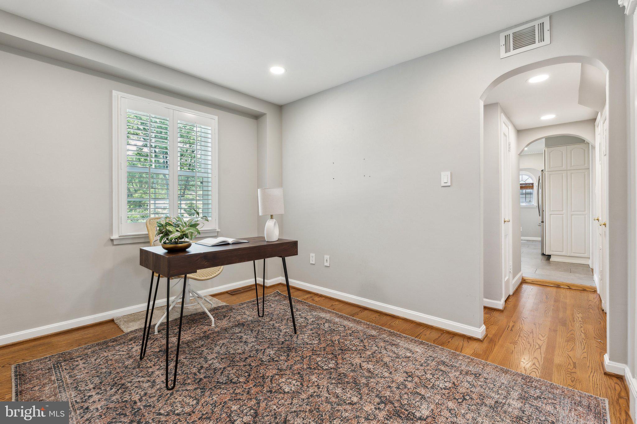 703 Roxboro Road Rockville, MD 20850 - Photo 22 of 55 a workspace room with furniture and wooden floor
