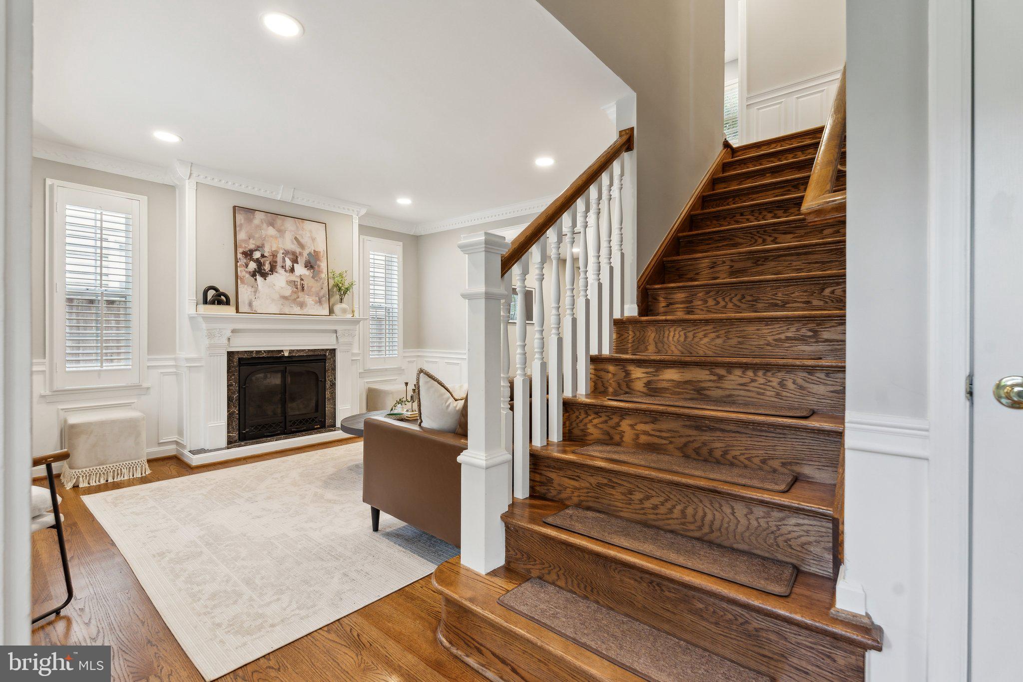 703 Roxboro Road Rockville, MD 20850 - Photo 26 of 55 a view of a livingroom with wooden floor and a fireplace