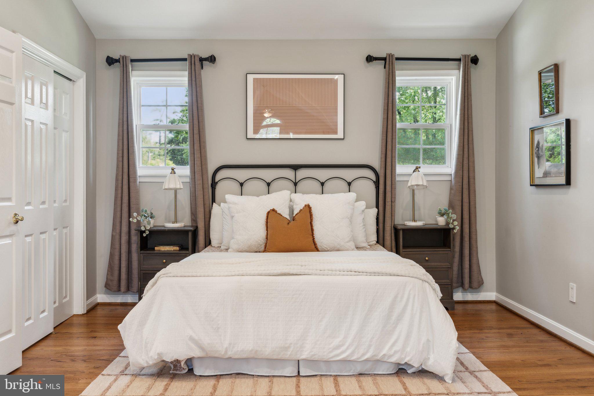 703 Roxboro Road Rockville, MD 20850 - Photo 27 of 55 a bedroom with a bed and wooden floor