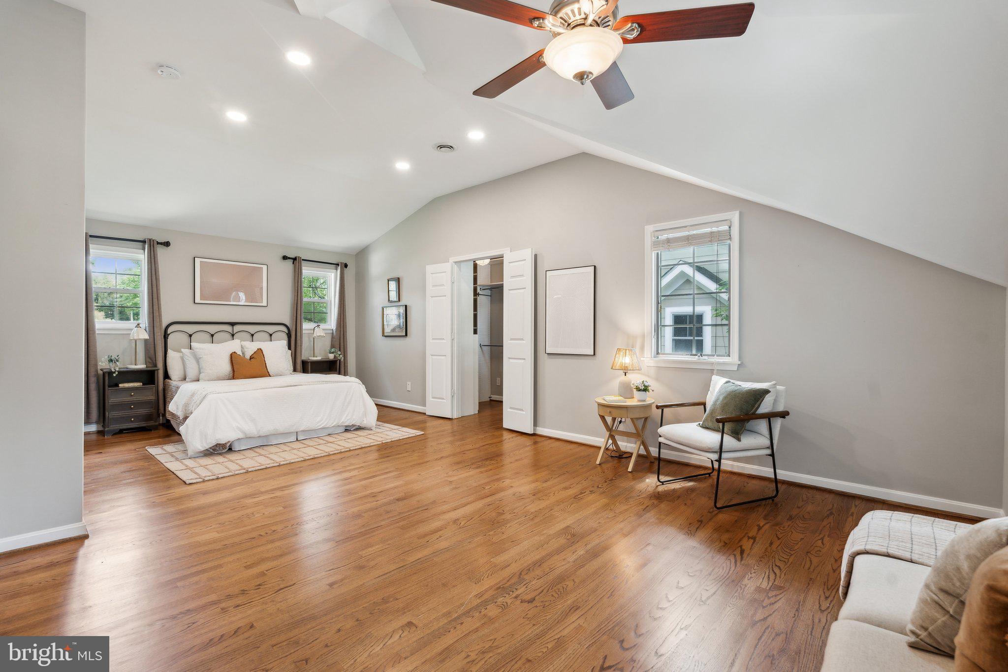 703 Roxboro Road Rockville, MD 20850 - Photo 33 of 55 a bedroom with a bed and wooden floor