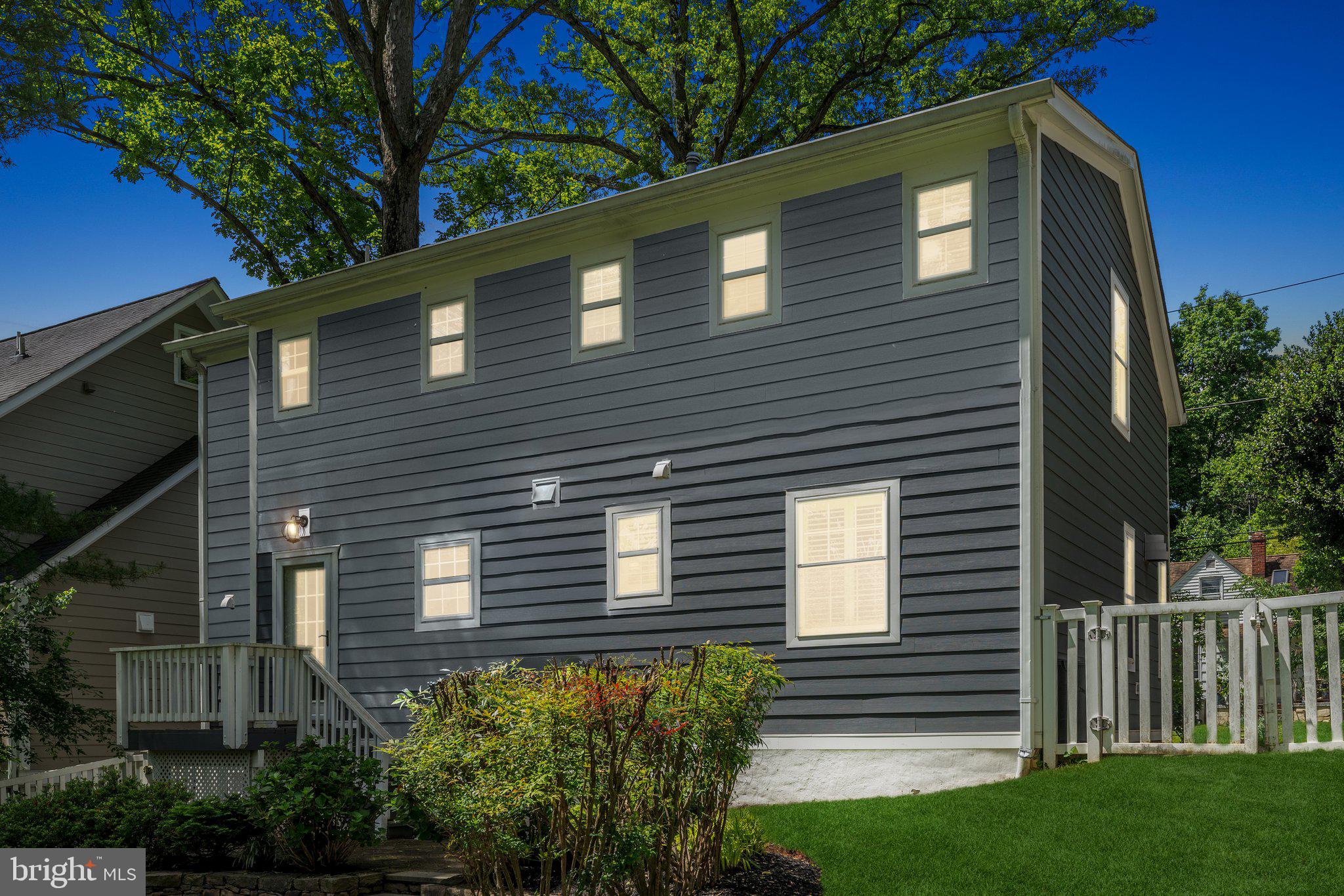 703 Roxboro Road Rockville, MD 20850 - Photo 43 of 55 a front view of a house with a yard