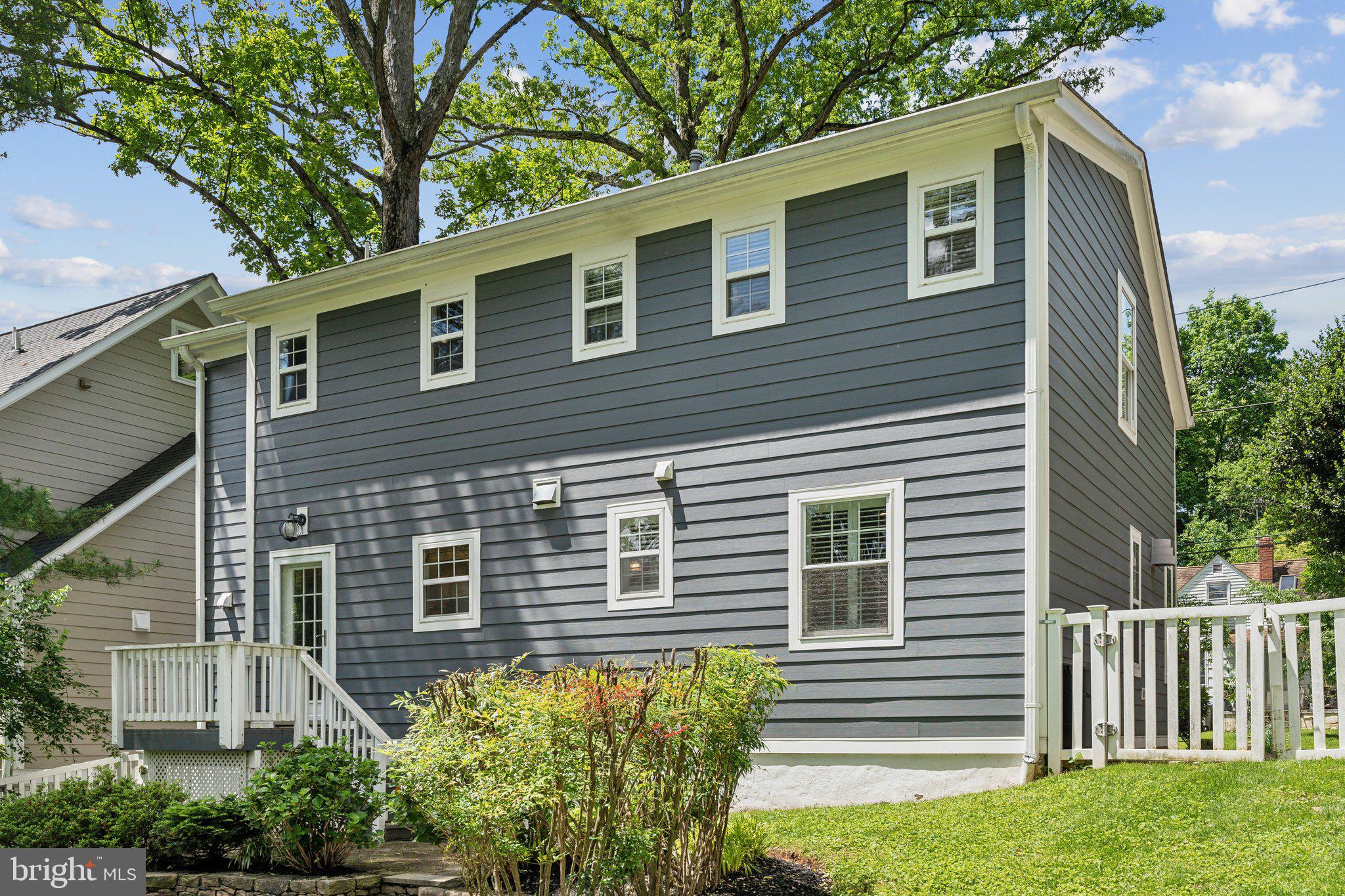 703 Roxboro Road Rockville, MD 20850 - Photo 45 of 55 a view of a house with a yard and potted plants