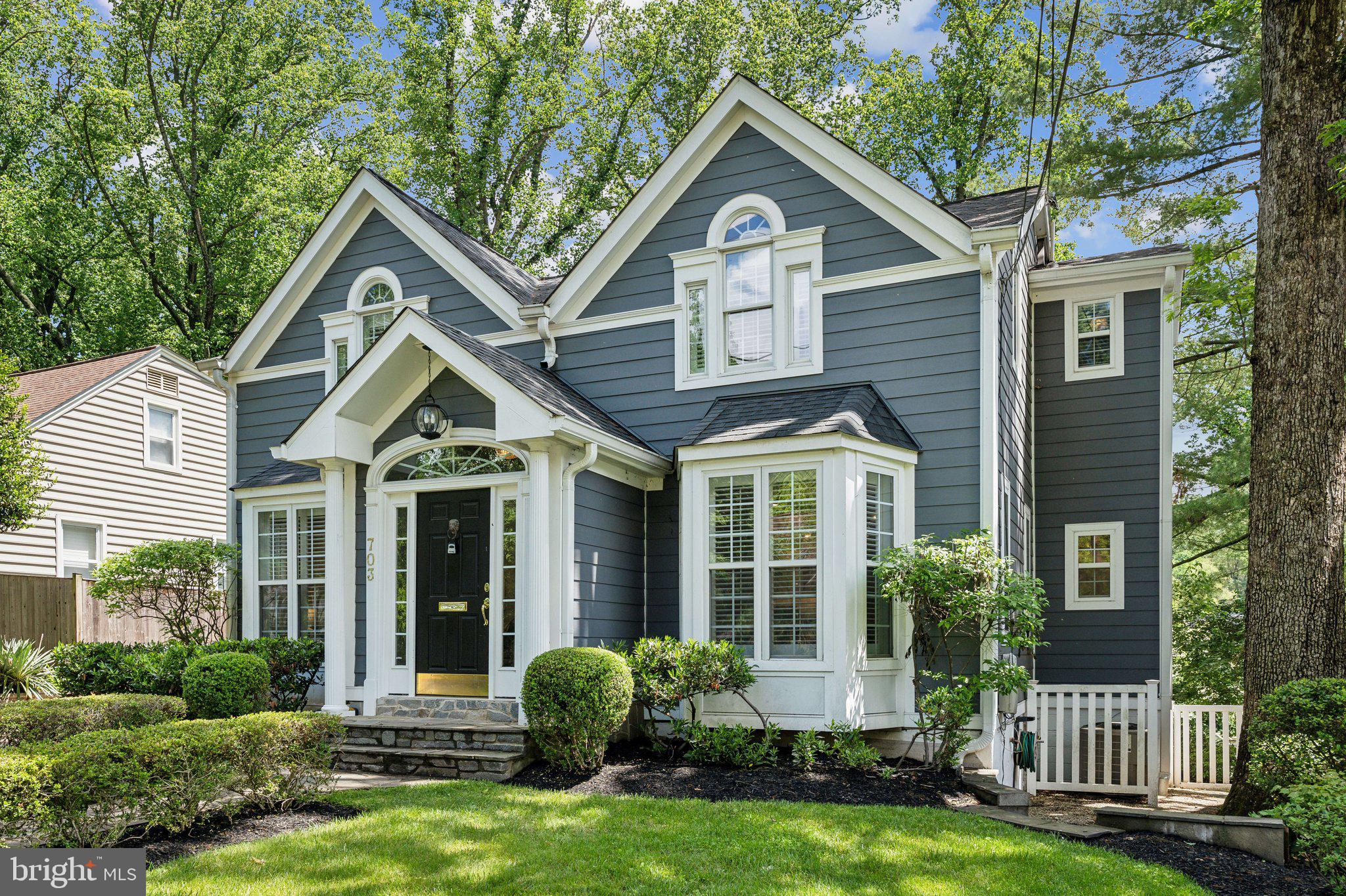 703 Roxboro Road Rockville, MD 20850 - Photo 6 of 55 a front view of a house with a yard and porch