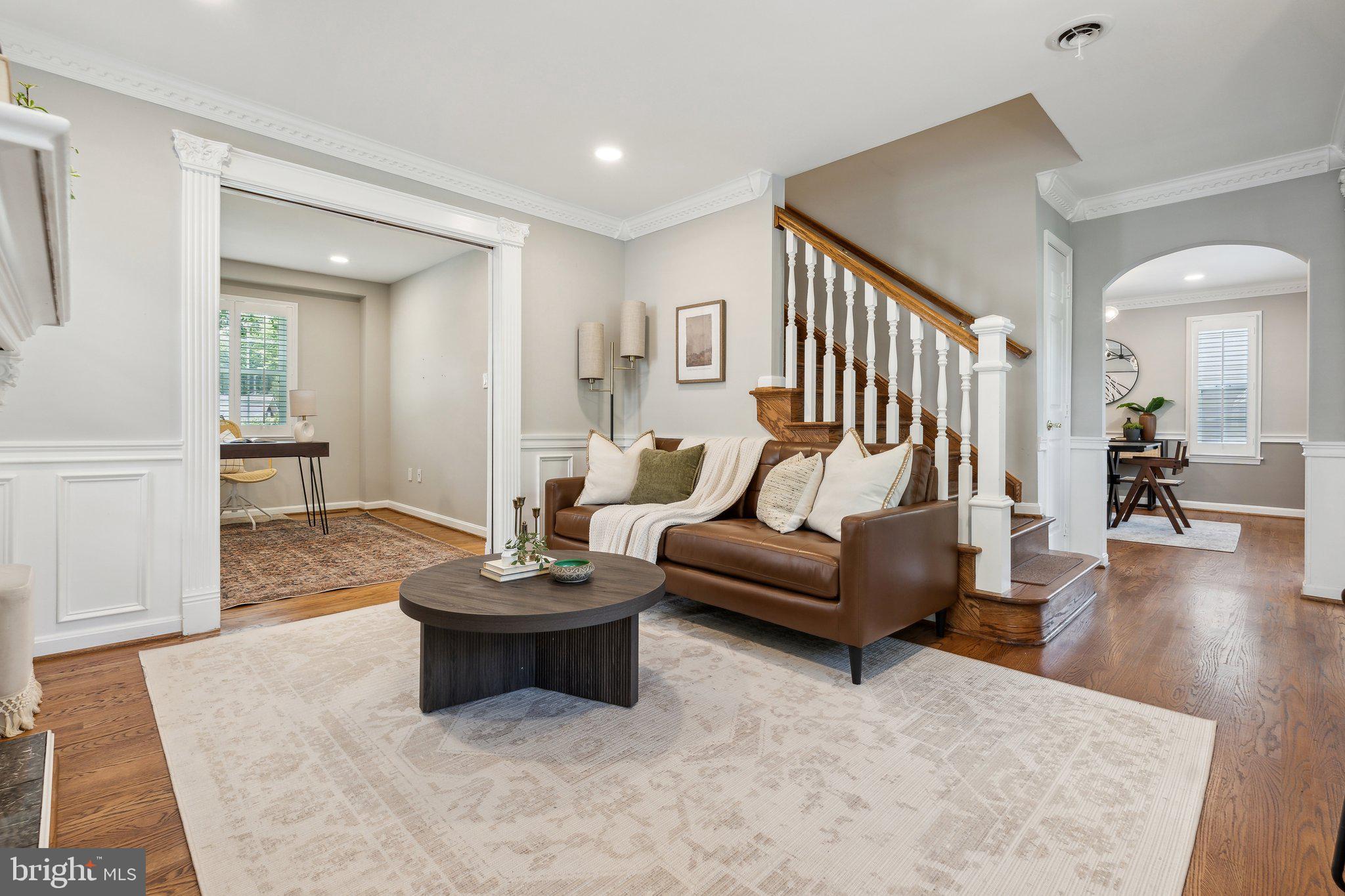 703 Roxboro Road Rockville, MD 20850 - Photo 7 of 55 a living room with furniture and a wooden floor