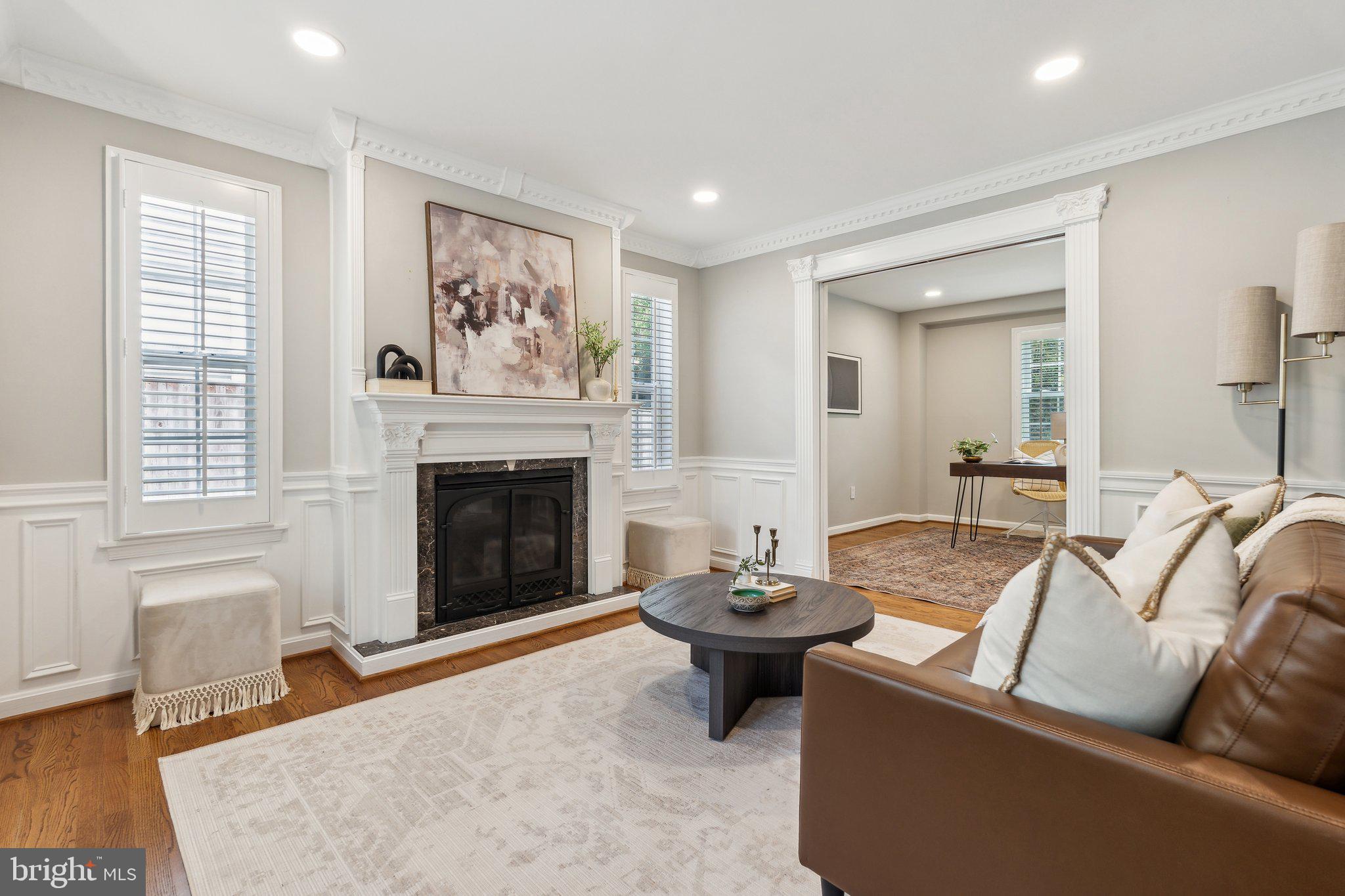 703 Roxboro Road Rockville, MD 20850 - Photo 8 of 55 a living room with furniture and a fireplace
