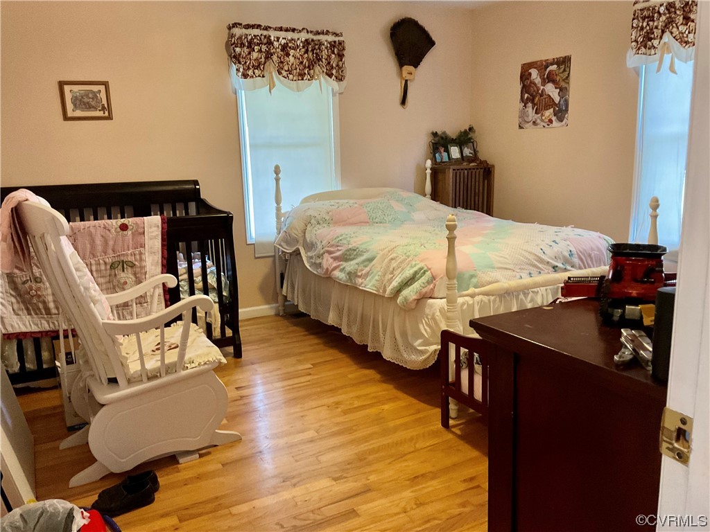 344 Old Mansion Road Victoria, VA 23974 - Photo 18 of 47 a bedroom with bed and wooden floor