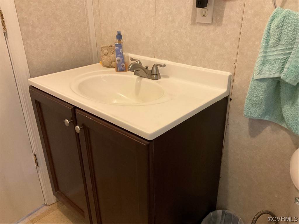 344 Old Mansion Road Victoria, VA 23974 - Photo 44 of 47 a bathroom with a sink and a mirror