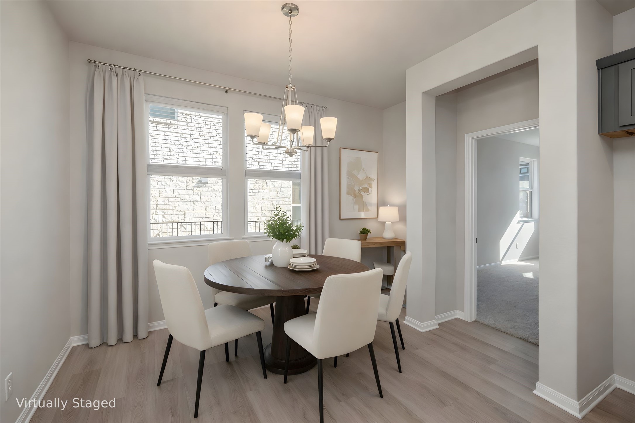 181 Soldier Street Kyle, TX 78640 - Photo 11 of 37 a view of a dining room with furniture wooden floor and a chandelier