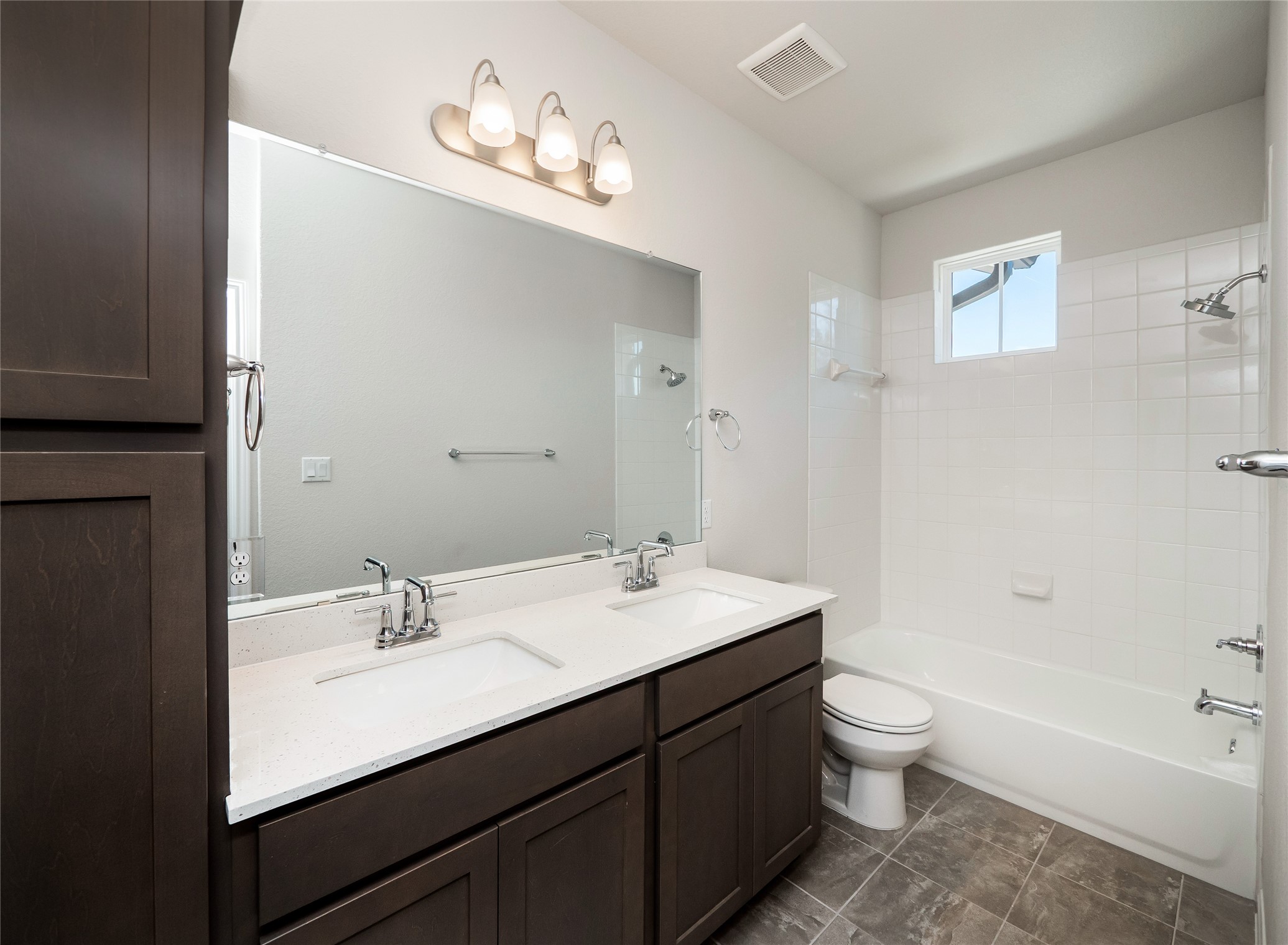 181 Soldier Street Kyle, TX 78640 - Photo 24 of 37 a bathroom with a tub sink toilet and a mirror