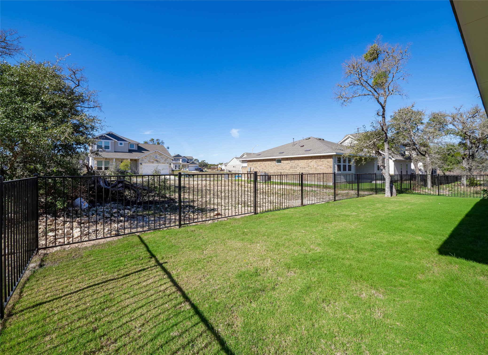 181 Soldier Street Kyle, TX 78640 - Photo 27 of 37 a view of a backyard and a patio