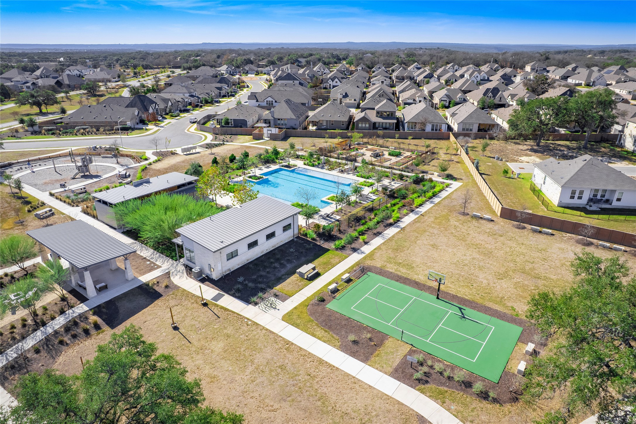181 Soldier Street Kyle, TX 78640 - Photo 34 of 37 an aerial view of a pool with a ocean view