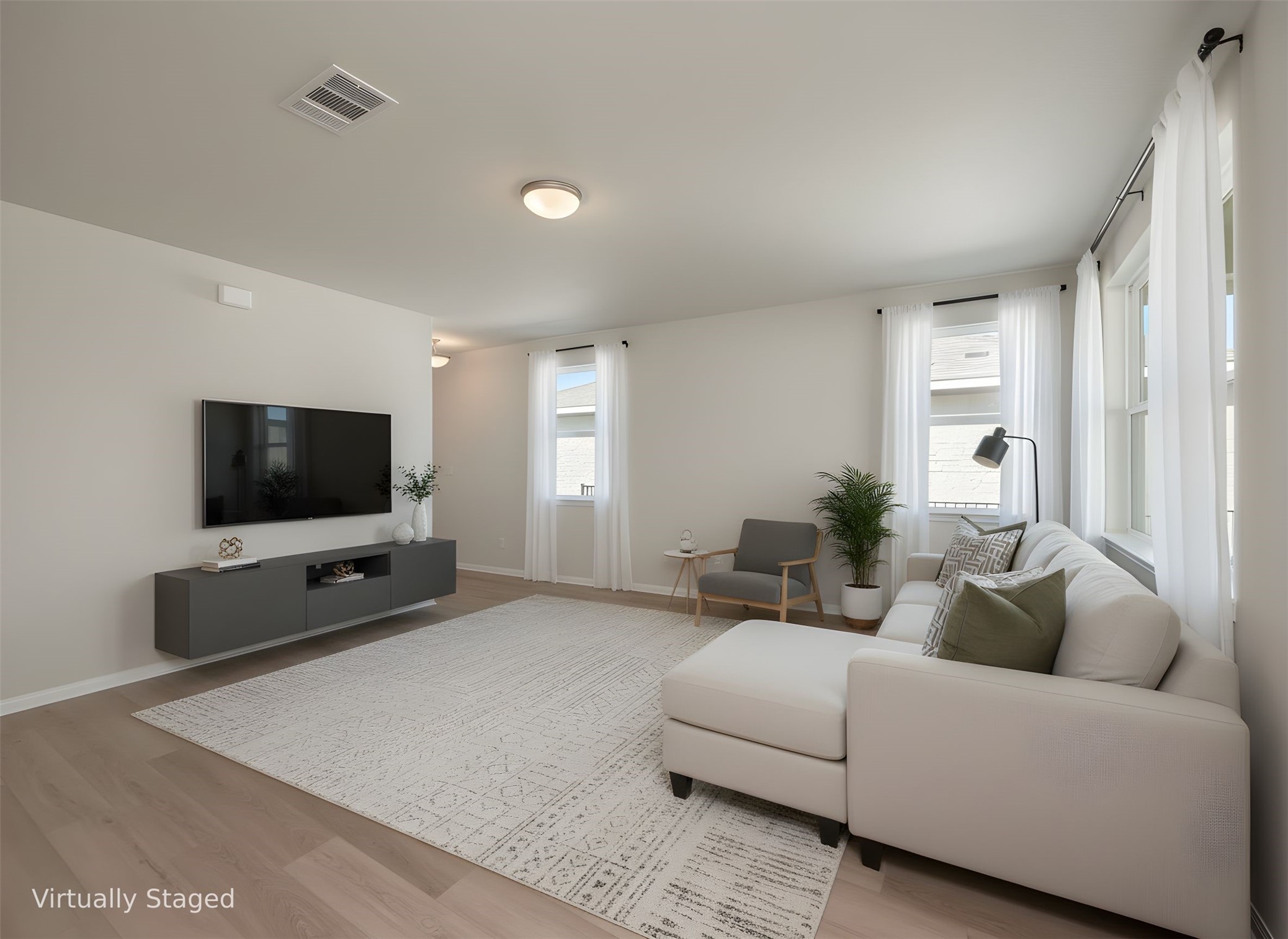 181 Soldier Street Kyle, TX 78640 - Photo 5 of 37 a living room with furniture and a flat screen tv