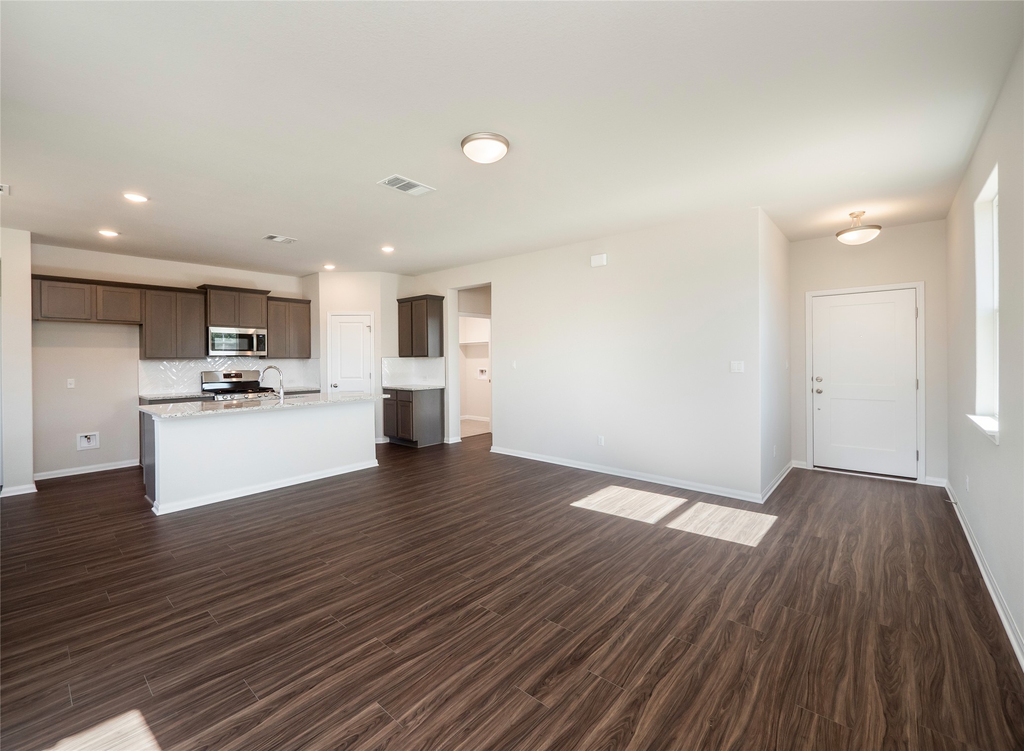 181 Soldier Street Kyle, TX 78640 - Photo 6 of 37 a view of kitchen with wooden floor