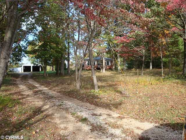 223 Evans Mill Road Dillwyn, VA 23936 - Photo 1 of 11 a backyard of a house with lots of green space