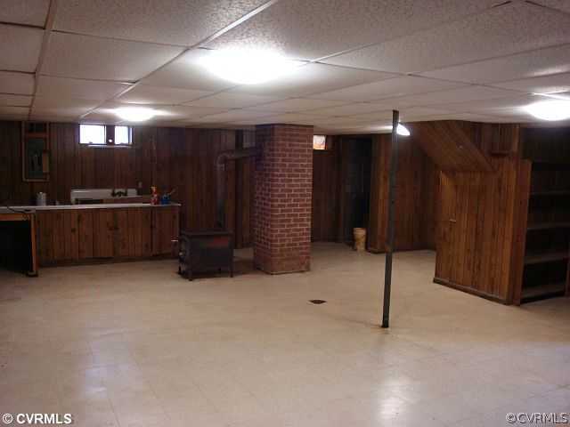 223 Evans Mill Road Dillwyn, VA 23936 - Photo 6 of 11 a view of an empty room with furniture and a kitchen