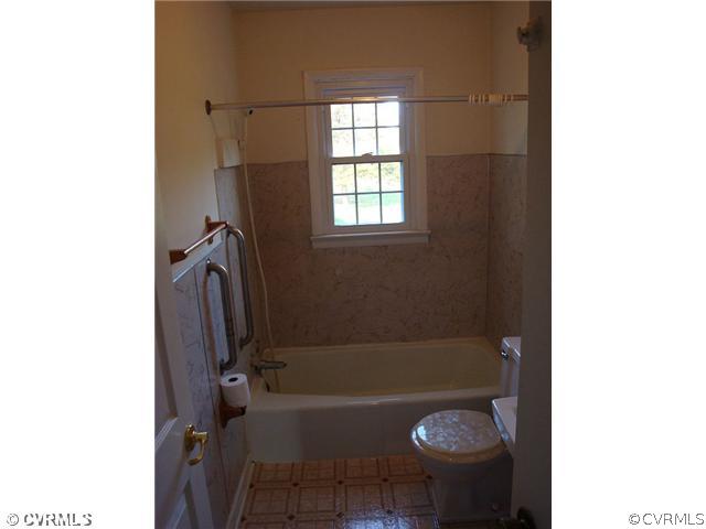 223 Evans Mill Road Dillwyn, VA 23936 - Photo 10 of 11 a bathroom with a tub and shower