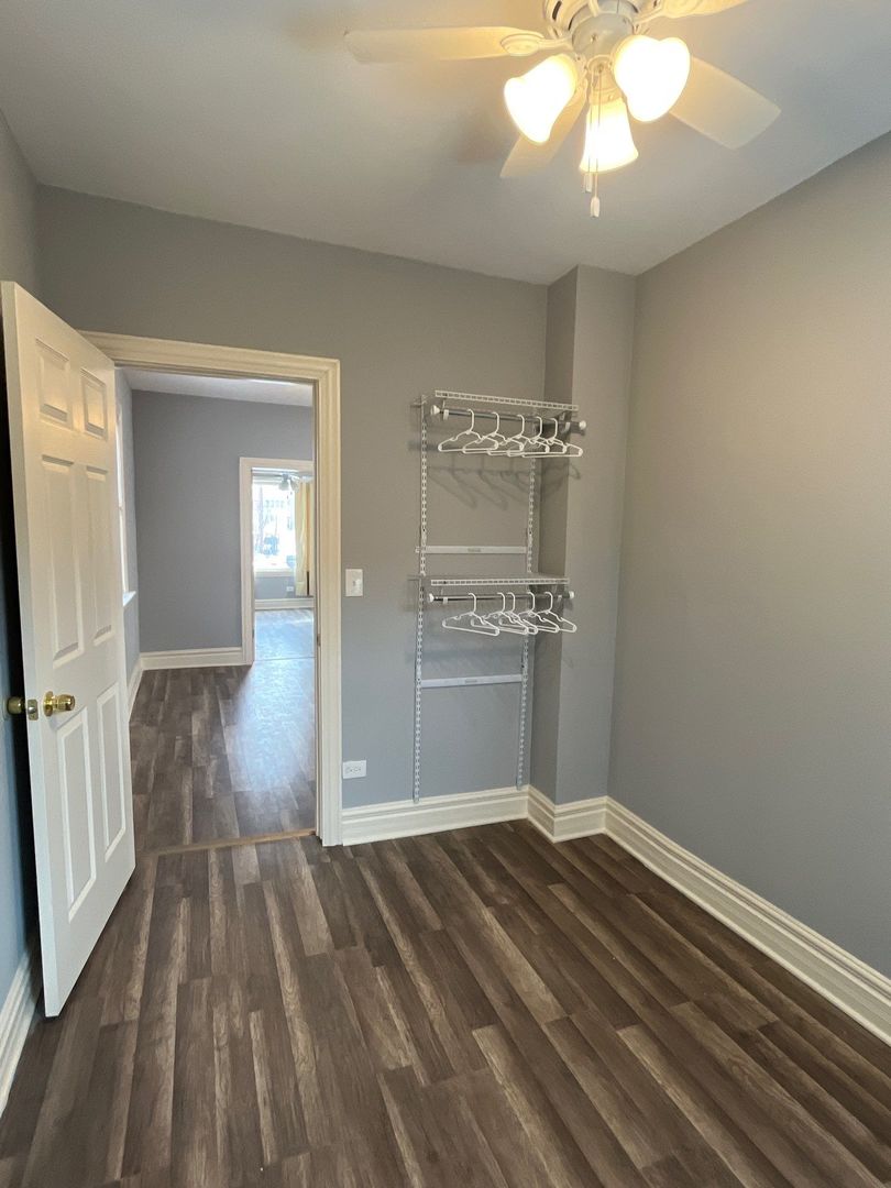 7438 South Champlain Avenue Chicago, IL 60619 - Photo 15 of 41 a view of livingroom with hardwood