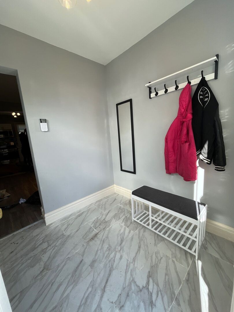7438 South Champlain Avenue Chicago, IL 60619 - Photo 4 of 41 a view of walk in closet with clothes and shoes
