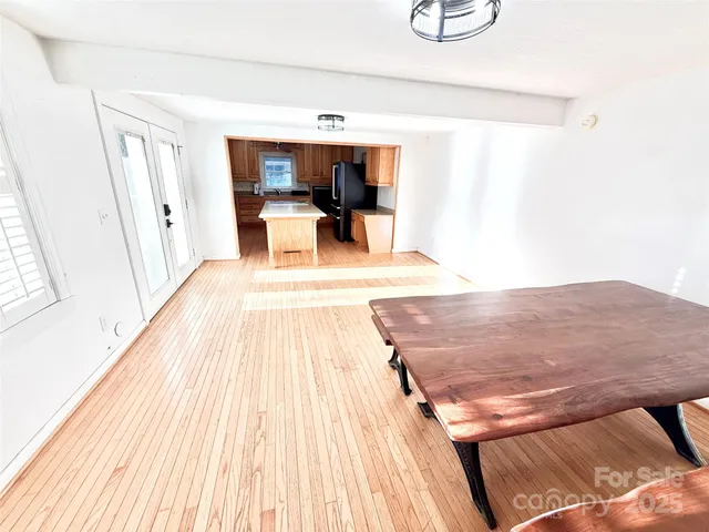 a view of kitchen with furniture and wooden floor