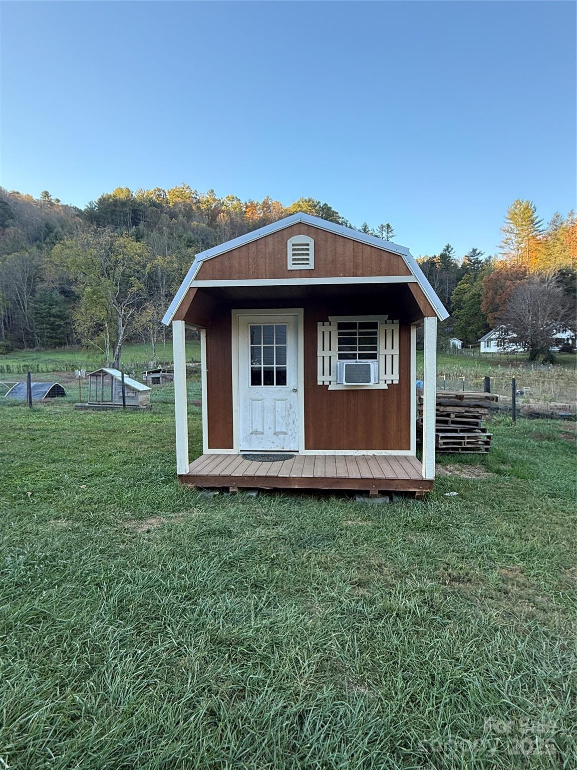 718 Bald Mountain Road Burnsville, NC 28714 - Photo 27 of 37 a view of a barn with big yard