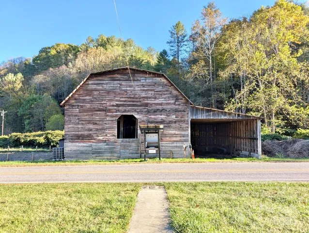 a swimming pool with outdoor seating and yard