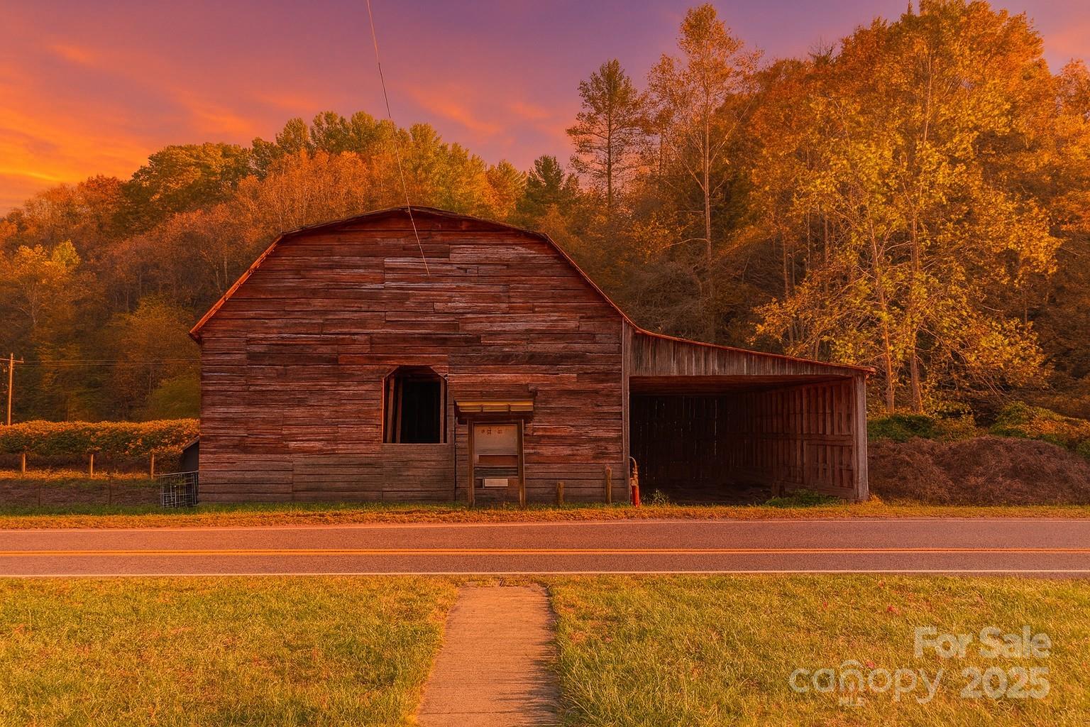 718 Bald Mountain Road Burnsville, NC 28714 - Photo 32 of 37 a front view of a house with a yard